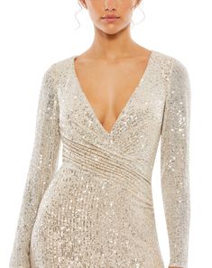 Ieena for Mac Duggal Sequined Fabric (100% polyester) Fully lined through bodice and skirt; semi-sheer unlined sleeves V-neck Long sleeve Faux wrap bodice Concealed back zipper Approx. 62.5" from top of shoulder to bottom hem Available in Nude/Silver and Dark Emerald Style #26574 Wendy Dress, Fall Wedding Dress, Sequined Fabric, Plastic Dress, Trumpet Gown, Sleeve Gown, Mac Duggal Dresses, Unique Prom Dresses, Prom Designs