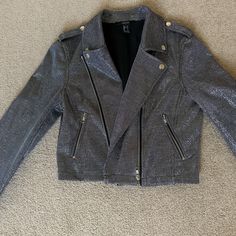 Never Worn Silver Sparkly Moto Jacket. Size S. Trendy Metallic Biker Jacket For Fall, Metallic Biker Jacket For Fall Party, Metallic Biker Jacket For Party In Fall, Trendy Metallic Biker Jacket For Winter, Metallic Long Sleeve Biker Jacket For Party, Trendy Silver Outerwear For Fall, Silver Biker Jacket For Fall, Silver Long Sleeve Biker Jacket For Fall, Fitted Metallic Biker Jacket For Winter