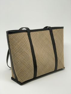 Upgrade your accessory game with our stylish rattan tote bag featuring genuine leather accents. Perfect for adding a touch of boho chic to any outfit! Free shipping worldwide. Color: Natural/black leather Material: Rattan/Cow leather Handle drop: 10.5" Height: 11.5" Width: top 17", bottom 14.25" Depth: 4" Lined, snap button closure with leather details. Sewing the classic rattan cane in a 45-degree angle brings a contemporary touch to this modern tote, resulting in a sharp and polished aesthetic Luxury Beach Bag With Leather Handles, Luxury Summer Shoulder Bag For Everyday, Luxury Everyday Summer Shoulder Bag, Chic Summer Shoulder Bag With Leather Trim, Elegant Straw Bag With Bamboo Handle For Daily Use, Chic Leather Shoulder Bag For Vacation, Black Woven Satchel Straw Bag, Chic Summer Bags With Leather Trim, Chic Leather Straw Bag With Woven Details