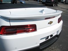 the back end of a white chevrolet camaro