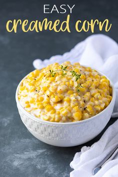 a white bowl filled with corn on top of a table