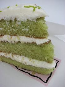 a piece of green cake with white frosting