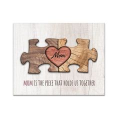 a wooden puzzle piece with the words mom is the piece that holds us together on it