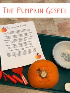 the pumpkin gospel is sitting on a tray next to a paper and utensils