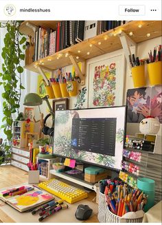 a desk with a computer monitor, keyboard and various office supplies on it's shelves