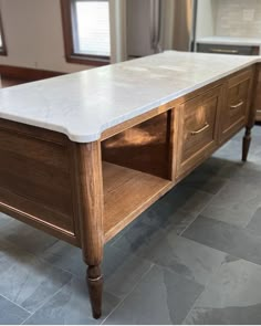 a white marble top coffee table in a kitchen