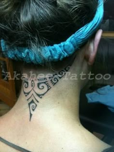 a woman with a tattoo on her neck