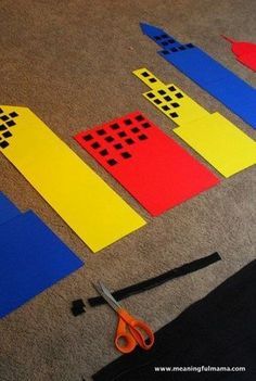 construction paper cut out into shapes on the floor