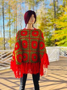 This is the CHRISTMAS Poncho, crafted from soft acrylic yarn in Christmas colors with a relatively long fringe to give it that wind blowing elegance. It is a one size fits most. Custom sizes like XXL and bigger can be made with a two weeks allowance for making and shipping. COLOR(s): Christmas Red and Green MATERIAL: 100% Acrylic yarn CARE: Machine washable and dryable. RETURN/ REFUND POLICY: No Refunds or Returns. All items are final sale. VERY IMPORTANT: I'm NOT responsible for shipping delays Christmas Red And Green, Wind Blowing, Ladies Poncho, Long Fringes, Green Material, Christmas Red, Christmas Colors, Hand Crochet, Red Christmas