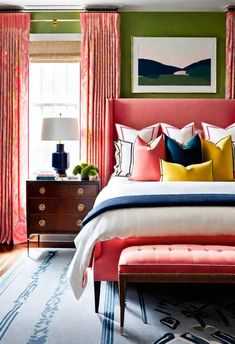 a bedroom with green walls and pink curtains