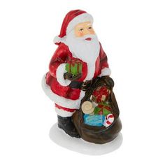 a santa clause figurine holding a bag of gifts