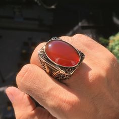 925 STERLING SILVER MEN'S RING WITH CARNELIAN Designed and handcrafted in Turkey Quality meets perfection! Bold & Elegant METAL : .925 Sterling Silver STONE: natural Carnelian also known as "aqeeq" RING DIMENSIONS: 25 x 30 mm SIZE: US 12.5 *for other sizes please leave a note during order Mens Band Rings, Sterling Silver Mens Rings, Big Rings, Handcrafted Artisan Jewelry, Mens Silver Rings, Mens Ring, Men's Jewelry Rings, Sterling Silver Mens, Unique Handmade Jewelry