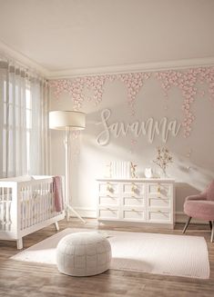 a baby's room with pink and white furniture, flowers on the wall, and a crib