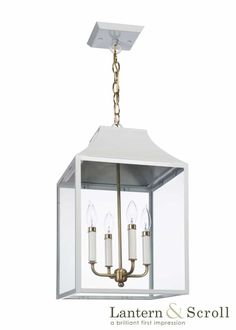 a light fixture with three candles hanging from it's center piece, and the words lantern