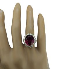 Stamped: 14K Total Ring Weight: 6.1 Grams Tourmaline Weight 8.23 Carat (13.60x11.70 Millimeters)Diamond Weight: 1.05 carat (F-G Color, VS2-SI1 Clarity )Face Measures: 19.00x16.50 Millimeter SKU: [600772] Gia Certified Tourmaline Rings For Formal Occasions, Oval Sapphire Tourmaline Ring For Formal Occasions, Formal Oval Sapphire Ring With Tourmaline, Oval Tourmaline Ring For Formal Occasions, Formal Oval Tourmaline Ring, Formal Oval Sapphire Ring, Formal Oval Tourmaline Ruby Ring, Oval Tourmaline Ruby Ring For Formal Occasions, Formal Oval Ruby Ring With Tourmaline