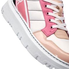 The D-player sneaker takes the classic basketball shoe and updates It In a couture version. The pink multicolor version Is crafted in a combination of technical fabric and calfskin and features patent details. Boasting a 'Christian Dior' signature band at the back, the contemporary sneaker is completed by a soft, lightweight sole.Round toeTreaded soleLace-upUpper: Technical Fabric, Leather; Sole: EVAMade in Italy Trendy Pink High-top Sneakers With Contrast Sole, Trendy Pink Leather Platform Sneakers, Pink Modern High-top Sneakers With Round Toe, Casual Patent Leather High-top Lace-up Sneakers, Casual Patent Leather High-top Sneakers With Round Toe, Modern Pink High-top Sneakers With Round Toe, Modern Pink High-top Sneakers, Luxury High-top Custom Sneakers With Translucent Outsole, Luxury Custom High-top Sneakers With Translucent Outsole