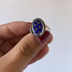 The sweetest little glass millefiori ovals turned into the perfect stacker! Please keep in mind each heart is glass varies in color / flowers. Don't forget to leave your ring size in the notes section at checkout! Blue Oval Enamel Rings, Dainty Oval Flower Ring For Gift, Dainty Oval Flower Ring As Gift, Hand Painted Oval Silver Jewelry, Silver Oval Hand Painted Jewelry, Glass Jewelry With Oval Beads For Gifts, Blue Oval Enamel Ring As Gift, Blue Oval Enamel Ring For Gift, Oval Beads Glass Jewelry For Gifts