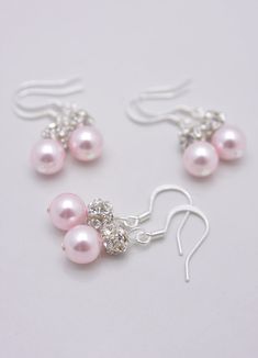 LISTING IS FOR ALL 6 PAIRS (not all are shown): These 6 pairs of light pink pearl earrings make a perfect bridesmaid gift. An 8mm rosaline Swarovski pearl sits beneath sparkling rhinestones set on sterling silver ear hooks. Each pair comes in a small gift box, perfect for gift-giving! Measures 1 1/2 inches long and shown on life-sized mannequin. Feel free to check out my other bridesmaid set listings: http://www.etsy.com/shop/AnaInspirations?section_id=11555045 SHIPPING: This item ships by USPS Pearl Bridesmaid Earrings, Bridal Statement Necklace, Gold Bar Earrings Studs, Pink Pearl Earrings, Bridesmaid Pearl Earrings, Bridesmaid Pearls, Emerald Earrings Studs, Pink Pearls, Thread Earrings