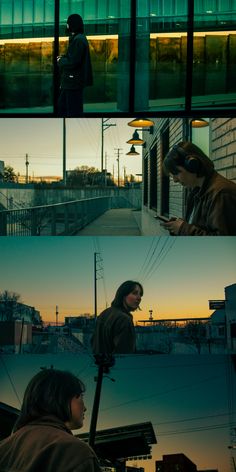 two people standing in front of a building at night and one person looking at his cell phone