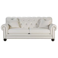 a white couch with some pillows on it