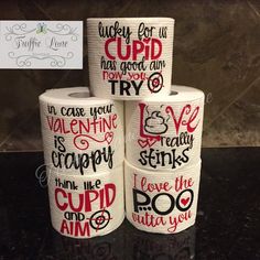 four rolls of toilet paper with sayings on them