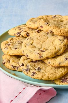 a plate full of chocolate chip cookies on a table