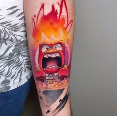 a person with a tattoo on their arm has an angry face and fire coming out of his mouth