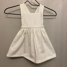 Cute White Pinafore Dress For 9-12 Months Handmade By Me. This Is Made From A White Cotton/Linen Blend That Has Been Pre Washed And Pre Shrunk! The Cross Back Straps Are Attached To A Elastic Waistband That Stretches From 16-22”. Please Ask Any Questions! White Cotton Sundress For Playwear, Cute White Cotton Pinafore Dress, White Sleeveless Cotton Pinafore Dress, Kids Pinafore Dress, White Pinafore, Purple Dresses Formal, Mini Boden Dress, Boho Shift Dress, Girls Smocked Dresses