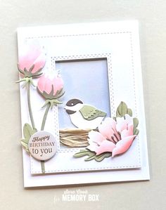 a birthday card with flowers and a bird on the branch in it's center