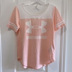 Nwt Under Armour Pink/Peachy & White Athletic Short Sleeve 3 Stripe Tee Shirt. Size Xs Under Armour White T-shirt With Graphic Print, White Under Armour T-shirt With Graphic Print, Under Armour Crew Neck Top With Letter Print, Under Armour Sporty Tops With Letter Print, Sporty Under Armour Tops With Letter Print, Under Armour Cotton Tops With Letter Print, Under Armour Cotton Summer Tops, Under Armour Short Sleeve Athleisure Top, Under Armour White Crew Neck Top