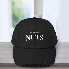 May contain nuts, but no promises or guarantees. Funny adult humor baseball hat caps, distressed style. Perfect gag gifts for dads, husbands, or anyone with a sense of humor :) -------------------------------------------------------------------- DISTRESSED VINTAGE CAP | PERFECT GIFTS FOR: Boyfriends Husbands  Dads Grandpas Uncles  College parties  Fraternity parties  Bachelor parties  Your best man Groomsmen  And more -------------------------------------------------------------------- DETAILS: MADE TO ORDER STYLE: Distressed, vintage  MATERIAL: 100% cotton twill DESIGN: 6-panel structure with an eyelet on each panel, unstructured body, low-profile VISOR: Curved CLOSURE: Self-fabric hideaway strap with metal D-ring slider SIZE: One size fits most COLORS: Black, gray, blue  ---------------- Gifts For Boyfriends, No Promises, Gifts For Dads, Bachelor Parties, College Parties, Distressed Hat, Dad Cap, Vintage Cap, Dad Caps