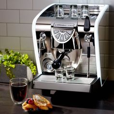 an espresso machine sitting on top of a counter