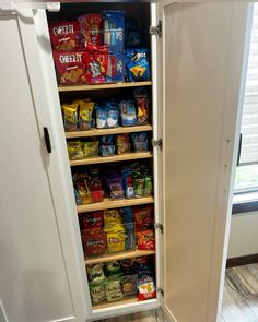 an organized pantry with food and snacks in the cupboards for storage or to store