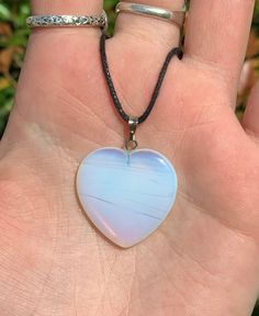 This listing is for an Opalite Heart Shape Pendant w/ Adjustable Cord Chain. A few options are pictured to show the natural variation in the stone. Opalite is a transparent to translucent stone that has a milky iridescent blue glow to it. This is enhanced when the stone is placed against a dark colored backdrop, because it creates a more luminous glow. Opalite is believed to be the stone of eternity because it brings understanding of the true self and of the free spirit. It is thought to allow u White Jewelry With Heart Beads For Healing, White Heart-shaped Crystal Necklace Gift, White Heart-shaped Crystal Necklace For Gift, White Heart-shaped Moonstone Jewelry, Handmade Heart Crystal Necklaces For Healing, Handmade Heart-shaped Crystal Necklaces For Healing, Handmade Heart-shaped Crystal Necklace For Healing, Spiritual White Heart-shaped Necklace, Spiritual White Heart Necklace