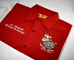 These are the very popular Red Kap Shop Shirts! These work shirts are embroidered, not a heat transfer! You can count on your logo and name looking very nice wash after wash! These shirts are available in short and long sleeves. Features: -4.25 oz., 65/35 polyester/cotton TouchTex™ poplin -Soil-release and wickable finish -Two button-through pockets -Left pocket has a pencil stall -Long sizes available (message me for details) -6 Color Choices -4 Font choices -The biz name will be embroidered on Red Short Sleeve Tops With Custom Embroidery, Red Cotton T-shirt With Custom Embroidery, Red Collared Cotton Camp Shirt, Red Cotton Collared Camp Shirt, Cotton Shirt With Custom Embroidery, Short Sleeve, Red Kap, Mechanic Shirts, Work Shirt, Cotton Logo