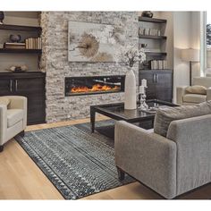 a living room filled with furniture and a fire place