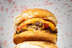 a cheeseburger is stacked on top of each other