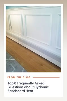 a white heater sitting on top of a hard wood floor next to a wall