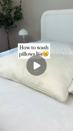 a pillow that is on top of a bed with the words how to wash pillows