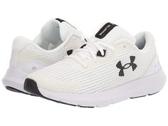 Under Armour Surge 3 - Women's Shoes : White/White/Black : Look sporty and stylish wearing the Under Armour Surge 3 Shoes. Textile and synthetic upper. Textile lining and insole. Lightweight and breathable. Round toe silhouette. Lace-up closure. Synthetic outsole. Imported. Double button pull through stud closure. Weight of footwear is based on a single item, not a pair. Sporty Under Armour Walking Shoes For Sports, Sporty Under Armour Walking Shoes, Sporty Breathable Under Armour Walking Shoes, Sporty Under Armour Walking Shoes For Running, Sporty Under Armour Walking Shoes For Jogging, Sporty Running Shoes With Studded Rubber Outsoles, Under Armour Lace-up Running Shoes With Cushioned Footbed, Under Armour Sporty Slip-on Sneakers, White Functional Running Shoes With Studded Outsoles