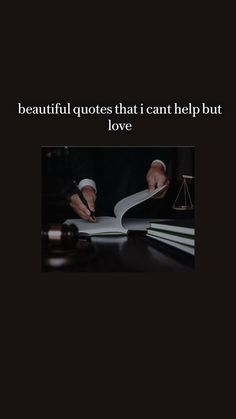 a person writing on top of a book next to a judge's gavel