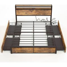 an image of a bed with drawers on the bottom and side rails that are made out of wood