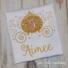 a white shirt with gold lettering and a princess crown on it that says, vivien sew cute creations