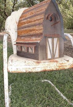 an old chair that has been turned into a house