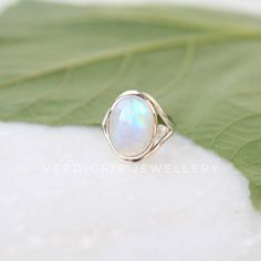 AAA Rainbow Moonstone ring, Real Sterling Silver ring, cocktail ring, alternative engagement ring, avant garde, birthstone ring, Rainbow Moonstone jewellery Description: Be assured that the product you order is MADE JUST FOR YOU and is not a mass produced item. The gemstone is a OVAL shaped AAA RAINBOW MOONSTONE GEMSTONE SIZE-16*12 mm. You have an option to choose a gem for yourself from a set of the stones. Please ask. The rest of the ring is made from 925 STERLING SILVER i.e 92.5% pure silver. Sterling Silver Moonstone Birthstone Ring, Unique Opal Ring With Moonstone, Sterling Silver Moonstone Halo Ring Gift, Sterling Silver Moonstone Ring With Halo For Gift, Fine Jewelry Moonstone Open Ring, Ethereal Opal Gemstone Ring For Gift, Ethereal Opal Ring As Gift, Sterling Silver Open Moonstone Ring, Fine Jewelry, Fine Jewelry Sterling Silver Open Moonstone Ring