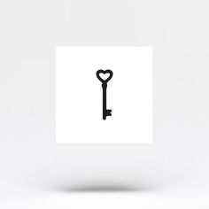 a key with a heart shaped hole in the middle on a white background is shown