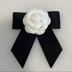 Designer Look, Luxury White Camellia Flower Black Bow Brooch Pin New, Never Used Black Handmade Flower Brooches, Black Brooches With Handmade Flowers For Gift, White Flower Lapel Pin For Formal Occasions, Handmade Flower Black Brooches For Gifts, Handmade Flowers Black Brooches For Gift, Elegant White Flower Lapel Pin, Chic Black Brooch For Gift, Chic Black Brooch As A Gift, Chic Black Brooches For Gifts