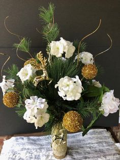 a vase filled with white flowers on top of a table