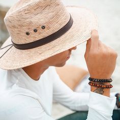 These men's bracelets by Lotus and Luna are wonderfully handcrafted by local female artisans in Thailand. They are made with semi-precious stones, 100% cotton cords and coconut shell clasps. Some of the stones used include Jade, Lava Stone, Turquoise and Hematite. The cords are fully adjustable to four different size options, so that you may get the perfect fit. Length ranges from 7.85 in at the first closure to 10.25 in at the last closure, so it will fit most wrists. Simply adjust to your perf Surfer Style Men, Earthy Bracelets, Men Bracelets, Surfer Style, Lucky Stone, Wood Bracelet, Tiger Eye Bracelet, Men's Bracelets, Natural Stone Bracelets