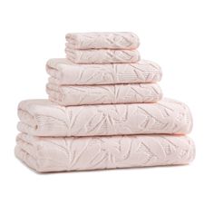 four towels stacked on top of each other in pink colors, with the word'love'printed on them